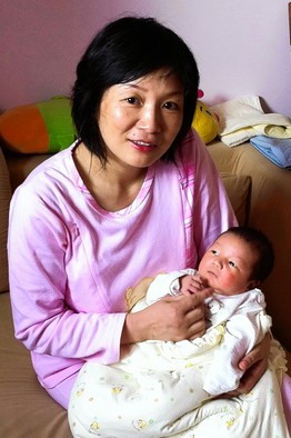 Chinese mother Mei Ting, with her Hong Kong-born baby boy